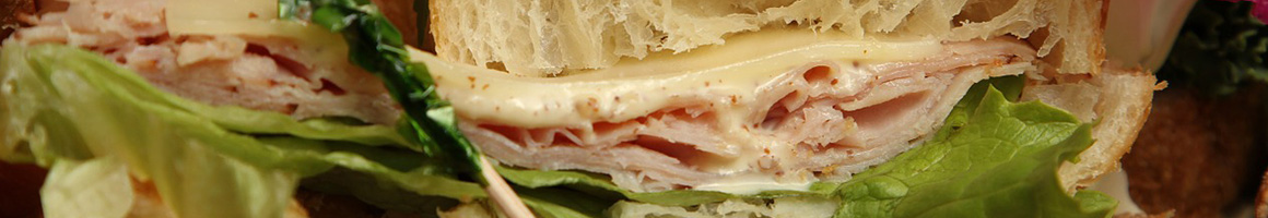 Eating Sandwich Cafe at Le Bistro restaurant in Oakland, CA.